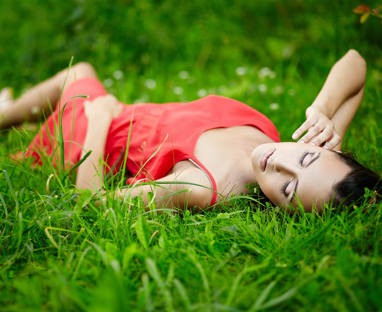 woman sleeping in grass