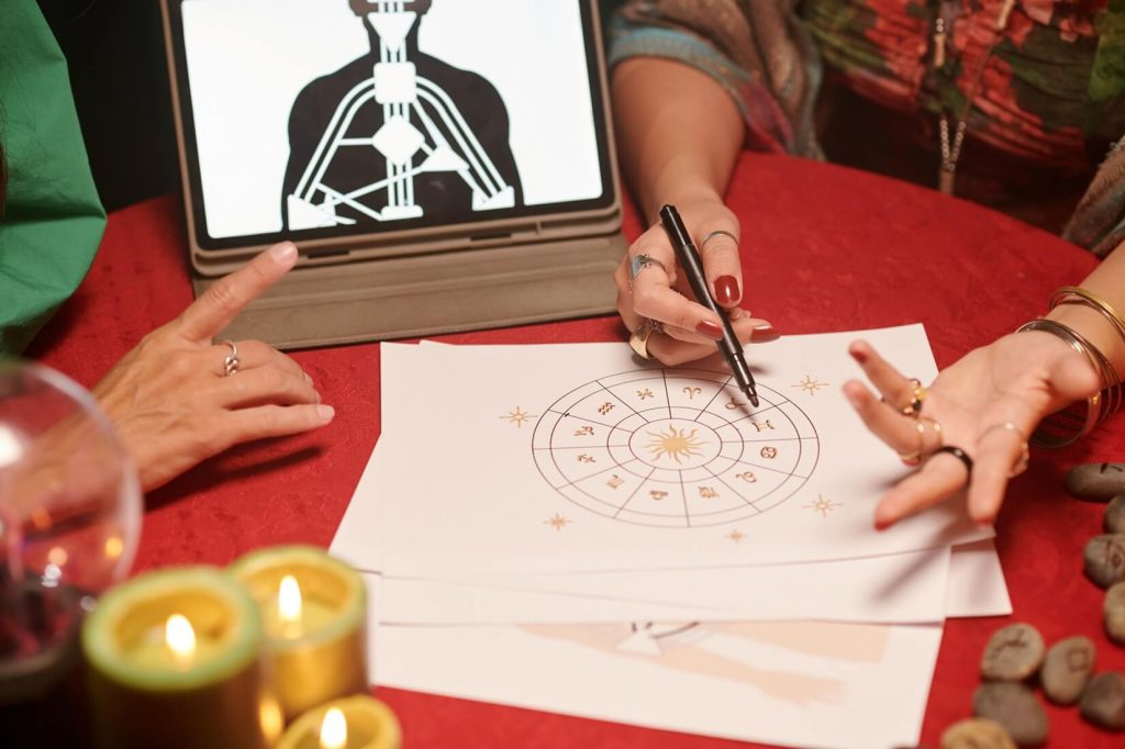 astrologer analyzing natal chart female client giving her advice